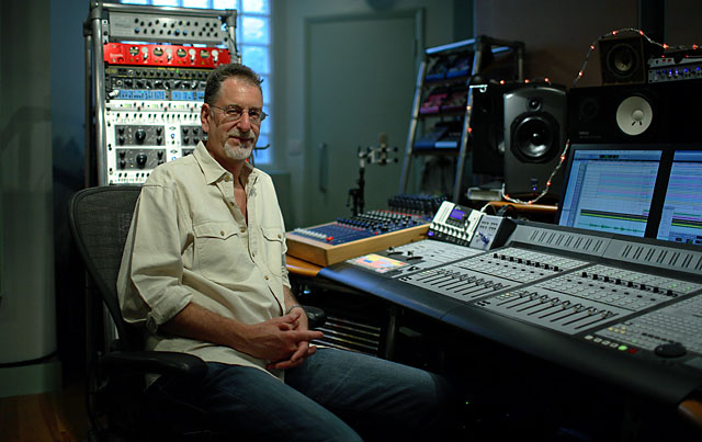 mick glossop in the studio control room at his private music studio
