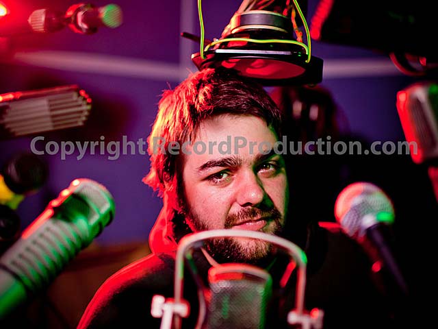 record producer phil english surrounded by microphones