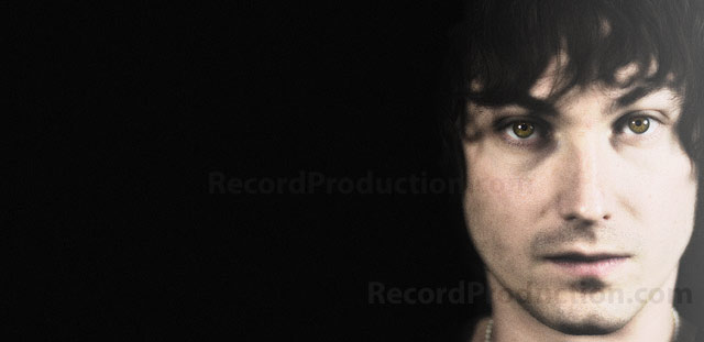record producer and musician tristan ivemy behind ssl mixing console at livingston studios